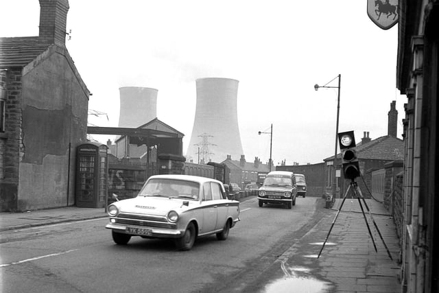 A bridge on Poolstock in Wigan in 1970 with the cooling towers of Westwood power station in the background.