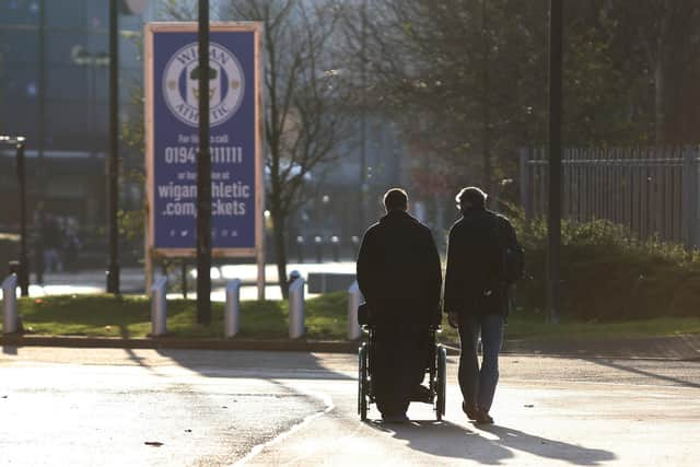 Fans outside Wigan Athletic's DW Stadium