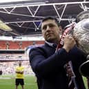 Wigan coach Matt Peet with the Betfred Challenge Cup trophy after victory over Warrington Wolves