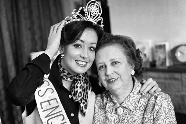 Pauline Davies at home with her mum in Lowton just after winning the Miss England 1976 title in March. Pauline was a draughtswoman until leaving to become a full time successful photographic fashion model. She went on to win many beauty titles around Britain. After winning the Miss England title she was a semi-finalist in the Miss Universe contest.  She also appeared in many television programmes during her career including "The Generation Game", It's a Knockout", Pebble Mill at One" and "Come Dancing".  Pauline went on to become a well known watercolour artist doing commercial work and private commissions.