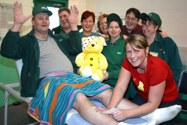 Staff at ASDA hold fund raising events for Children In Need.