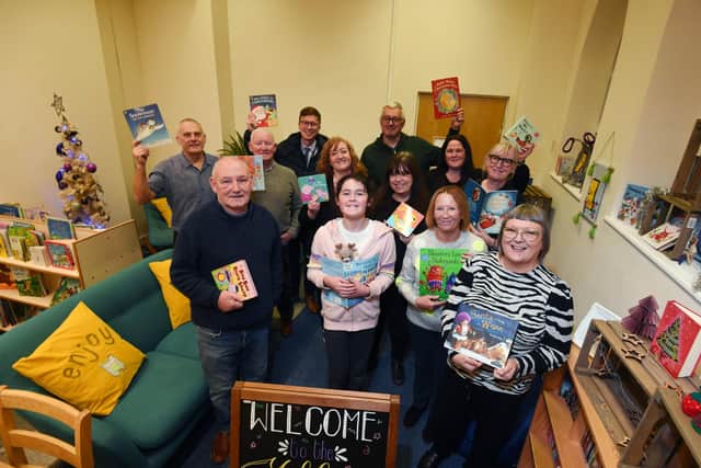 Volunteers and members of the community involved in the Yellow Door Community Library, a new childrens library based at Clifton Street Community Centre, Poolstock, Wigan.