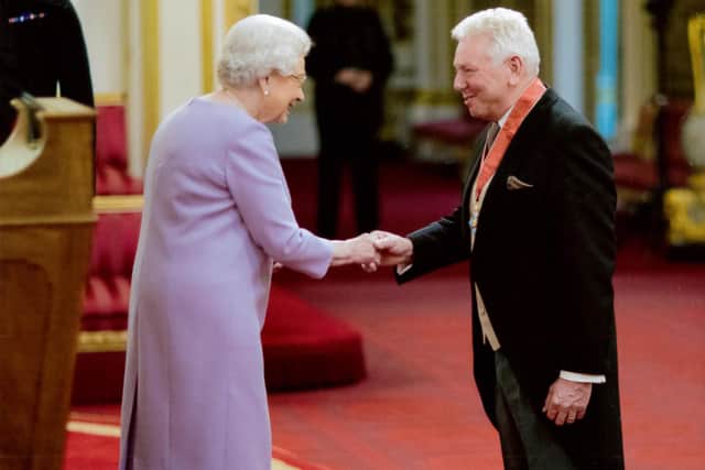 Martin Ainscough receives his CBE from the Queen