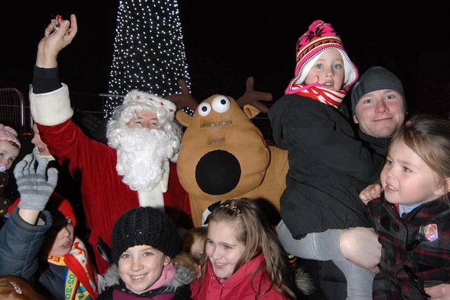 Golborne Christmas lights switch-on:  Father Christmas, brought along by The Rotary Club of Golborne Lightshaw, and the reindeer from Golborne Asda with with local children