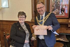 Rachel Heyden receives the Heart of the Community Award from Mayor of Wigan Coun Kevin Anderson