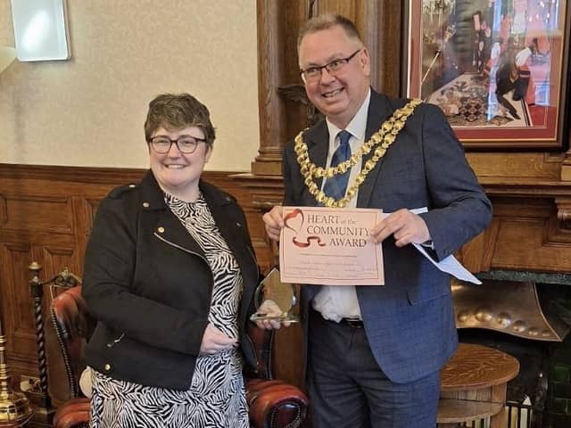 Rachel Heyden receives the Heart of the Community Award from Mayor of Wigan Coun Kevin Anderson