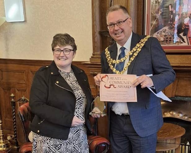 Rachel Heyden receives the Heart of the Community Award from Mayor of Wigan Coun Kevin Anderson