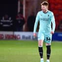 Luke Robinson has returned to Wigan after suffering a knee injury during his loan spell at St Johnstone