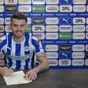 Charlie Kelner puts pen to paper with Latics