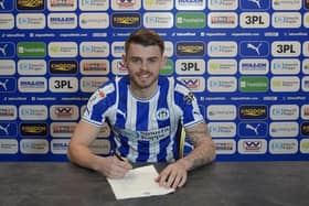 Charlie Kelner puts pen to paper with Latics