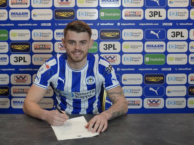 Charlie Kelner puts pen to paper with Latics