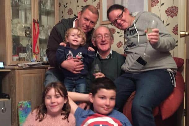 Jimmy Whisker, centre, with his children and grandchildren