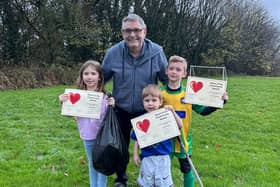 Coun Chris Ready with young litter pickers Holly Power, six, Lewis Power, three, and Isaac McCarren, eight