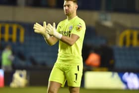 Jamie Jones salutes the travelling fans at Millwall