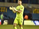 Jamie Jones salutes the travelling fans at Millwall