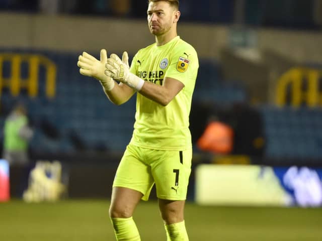 Jamie Jones salutes the travelling fans at Millwall