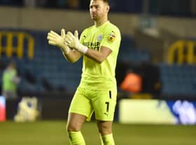 Jamie Jones salutes the travelling fans at Millwall