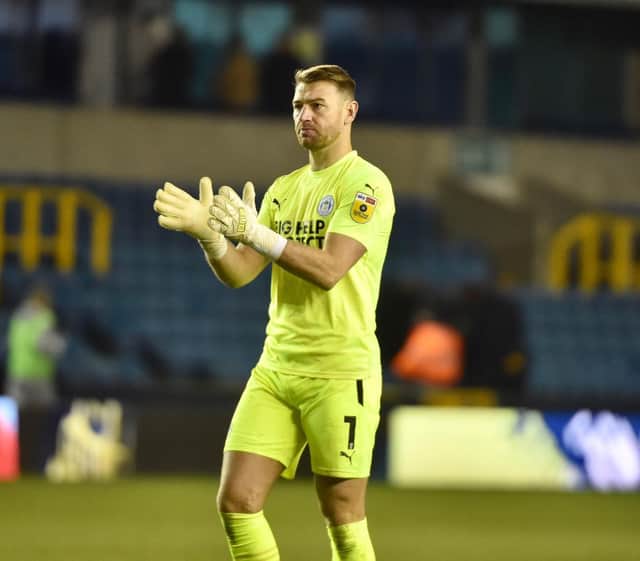 Jamie Jones salutes the travelling fans at Millwall