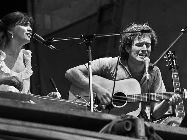 Gay and Terry Woods on stage on Friday 15th at the 1977 July Wakes Folk Festival at Park Hall, Charnock Richard.