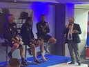 The Latics management team discover the fixtures for the new campaign at the DW Stadium