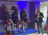 The Latics management team discover the fixtures for the new campaign at the DW Stadium