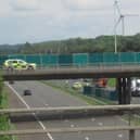 The crash scene on the M58 with screens erected around it