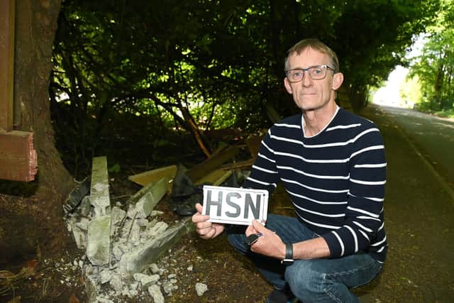 Rob Hodgson outside his home on Kenyon Lane, Croft, near Lowton, where a car crashed into his fence and drove off.