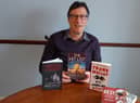 Frank Malley with his latest books including The Hit List
