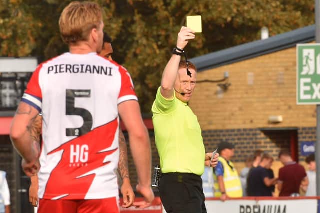 All hell broke loose after Charlie Hughes was the victim of a crude lunge at Stevenage
