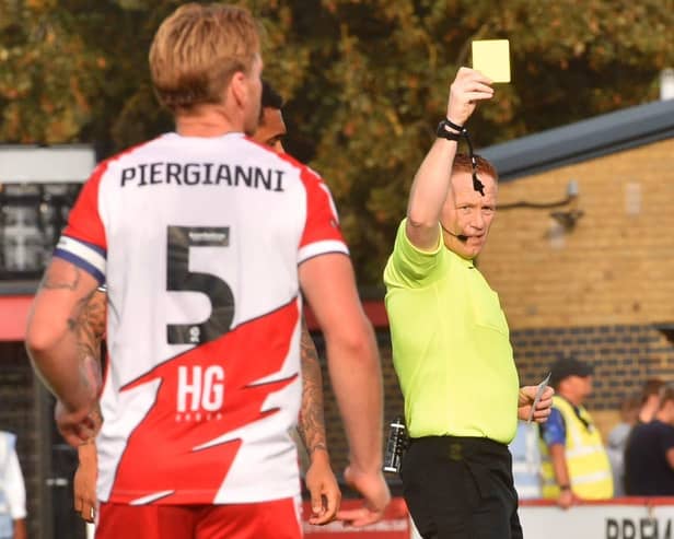 All hell broke loose after Charlie Hughes was the victim of a crude lunge at Stevenage