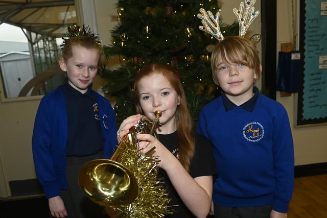 Members of the Fred Longworth High School brass band entertain pupils at the Winter Wonderland celebration party at Hindsford CE Primary School, Atherton.