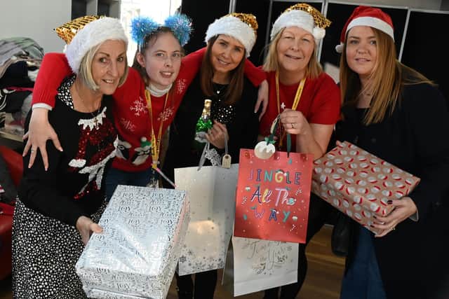 Noreen Bond, Katie Wilkes, Joanne Bimson, Maureen Holcroft and Shelley Brady with gifts for Daffodils Dreams' Christmas Eve box appeal
