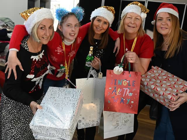 Noreen Bond, Katie Wilkes, Joanne Bimson, Maureen Holcroft and Shelley Brady with gifts for Daffodils Dreams' Christmas Eve box appeal