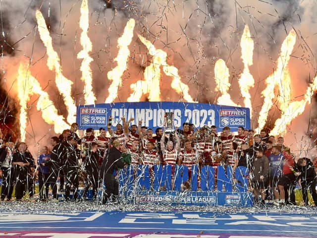 Wigan Warriors lift the Super League trophy