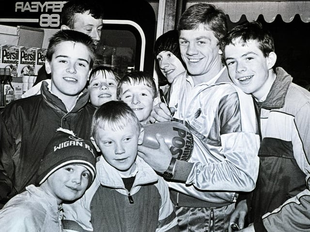Wigan RL and Great Britain full back Steve hampson signs autographs for young fans