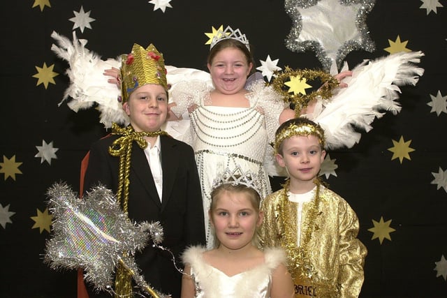 Hindley CE All Saints Primary are holding their annual nativity play The Hoty Toity Angel. Pictured LtR: Johnathan Trezise as King Herod, Emma Steele as Hoity Toity Angel, Jessica Forrester as Main Star and Connor Sharples as Gabriel, 2004.
