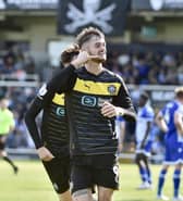 Joe Hugill celebrates one of his two goals at Bristol Rovers at the beginning of the season