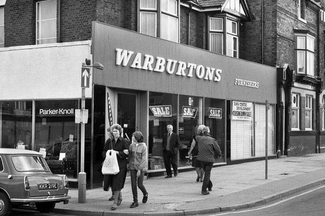 A closing down sale at Warburtons furnishers next to The Park pub on Hope Street, Wigan, in August 1982.