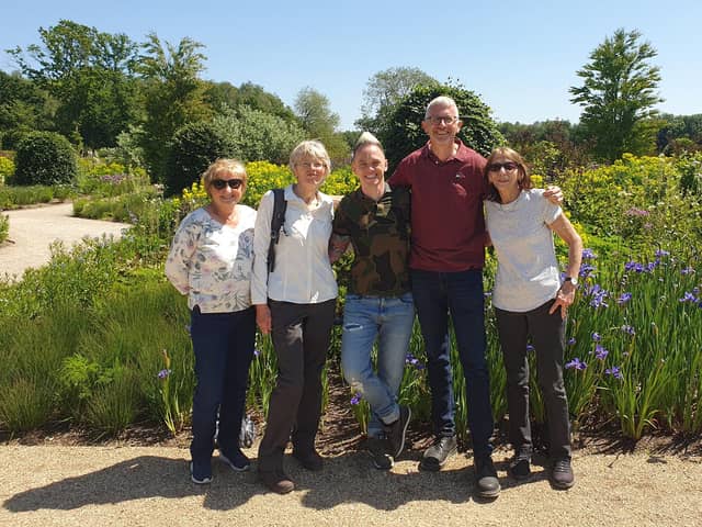 Wigan and Leigh Hospice's gardener Jim Nicholson and volunteers with Lee Burkhill, known as the Ninja Gardener