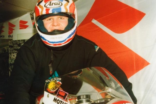 Mick Cassidy tries out a motorbike in the 1990s