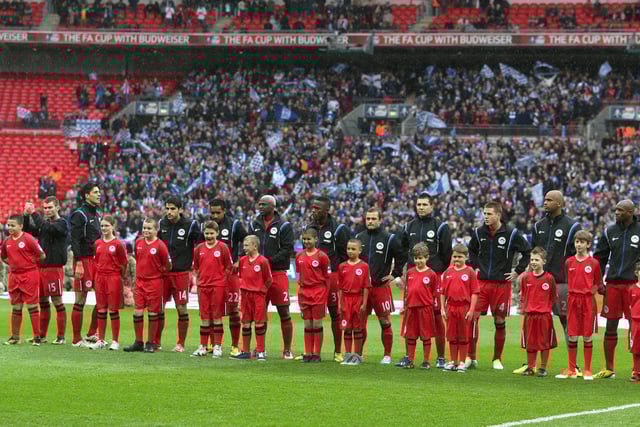 The Wigan Athletic team line up ahead of the FA Cup with Budweiser Semi Final match between Millwall and Wigan Athletic at Wembley Stadium on April 13, 2013 in London, England.