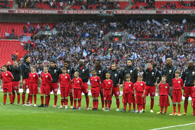 The Wigan Athletic team line up ahead of the FA Cup with Budweiser Semi Final match between Millwall and Wigan Athletic at Wembley Stadium on April 13, 2013 in London, England.