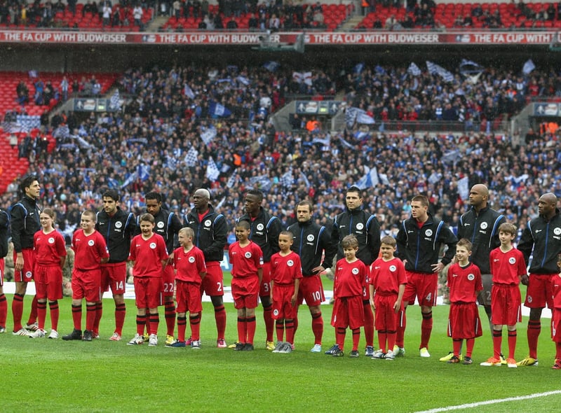 The Wigan Athletic team line up ahead of the FA Cup with Budweiser Semi Final match between Millwall and Wigan Athletic at Wembley Stadium on April 13, 2013 in London, England.