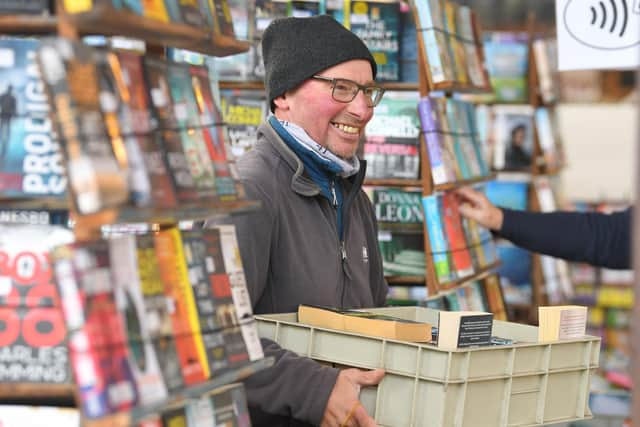 Derek Walsh on Derek's Books stall, Preston Market