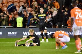 The Latics players are in shock after Blackpool's last-gasp leveller robbed them of two points