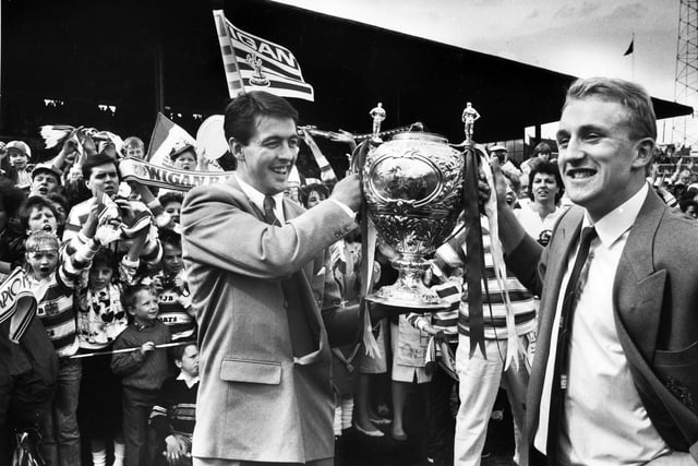 Joe Lydon and Shaun Edwards show the cup to fans at Central Park at the homecoming of the Wigan team on Sunday 1st of May 1988 after their Wembley triumph. 