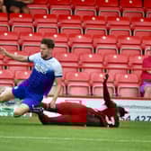 Callum Lang is felled at Accrington