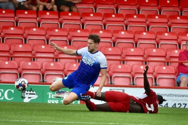 Callum Lang is felled at Accrington