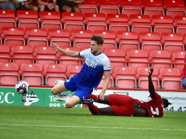 Callum Lang is felled at Accrington