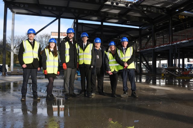 Staff and students take a look around the site of their new school.
